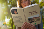 hardcover-book-mockup-featuring-a-young-woman-reading-at-the-park-3411-el1